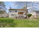 Large backyard featuring a deck and mature tree at 11347 Whitewater Way, Fishers, IN 46037