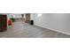Spacious finished basement with modern bar area, adjacent to lounging area with decorative fireplace at 11347 Whitewater Way, Fishers, IN 46037
