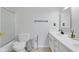 Bathroom featuring a shower, toilet, and a vanity with a sink and mirror at 11347 Whitewater Way, Fishers, IN 46037