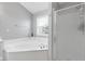 A spacious bathroom featuring a large tub and separate shower at 11347 Whitewater Way, Fishers, IN 46037