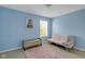 Bedroom featuring blue walls, a futon and a bench at 11347 Whitewater Way, Fishers, IN 46037