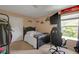 A bedroom with a bed, a TV, and shelves at 11347 Whitewater Way, Fishers, IN 46037