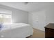 Bright bedroom with a bed, closet, and a view of the outdoors from the window at 11347 Whitewater Way, Fishers, IN 46037