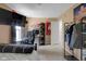 This bedroom contains a wall mounted TV, desk, and decorative wall art at 11347 Whitewater Way, Fishers, IN 46037