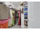 Walk-in closet filled with hanging clothes, shelf and drawer units for accessories and storage at 11347 Whitewater Way, Fishers, IN 46037