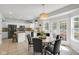 Bright kitchen and dining nook with a view of the outdoor patio and access to the spacious kitchen at 11347 Whitewater Way, Fishers, IN 46037