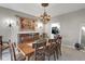 Elegant dining room with a chandelier, large dining table, and refined decor, perfect for entertaining guests at 11347 Whitewater Way, Fishers, IN 46037