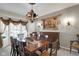 Charming dining area with a large window and elegant decor, ideal for Gathering meals and gatherings at 11347 Whitewater Way, Fishers, IN 46037
