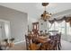 Inviting dining room featuring a large window and elegant decor, adjacent to the front door for seamless entertaining at 11347 Whitewater Way, Fishers, IN 46037