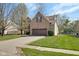 Charming brick home with a well-maintained lawn and mature trees, creating an inviting curb appeal at 11347 Whitewater Way, Fishers, IN 46037