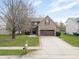 Charming brick house with a two car garage and large front yard at 11347 Whitewater Way, Fishers, IN 46037