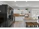 Bright kitchen with white cabinets, granite countertops, and modern appliances, combining style and functionality at 11347 Whitewater Way, Fishers, IN 46037