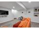 Spacious living room with hard floors, modern TV setup, and comfortable couch at 11347 Whitewater Way, Fishers, IN 46037