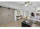 Open concept living room featuring a fireplace and decorative sliding barn doors at 11347 Whitewater Way, Fishers, IN 46037