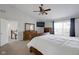 Bright, spacious bedroom featuring a bed, dresser, and television, creating a relaxing retreat at 11347 Whitewater Way, Fishers, IN 46037