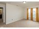 This is a cozy bedroom featuring neutral walls, carpet flooring, and a window at 11617 Tahoe Way, Indianapolis, IN 46235