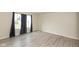 Bright bedroom featuring a large window with dark curtains and gray vinyl floors at 11617 Tahoe Way, Indianapolis, IN 46235