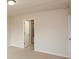 This bedroom features neutral walls, carpet flooring, a door, and a light fixture at 11617 Tahoe Way, Indianapolis, IN 46235