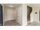 Entryway featuring gray vinyl floors, a front door, coat closet and staircase to the upper level at 11617 Tahoe Way, Indianapolis, IN 46235