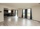 Bright living room featuring neutral walls, vinyl floors, and natural light from large windows at 11617 Tahoe Way, Indianapolis, IN 46235