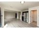 Open living area featuring neutral paint, gray vinyl floors, and a modern kitchen at 11617 Tahoe Way, Indianapolis, IN 46235