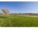 Scenic backyard with a pond view and well-maintained lawn in a residential community at 11880 Whisper Ridge Dr, Noblesville, IN 46060