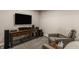 Cozy finished basement area with television, table and chairs at 11880 Whisper Ridge Dr, Noblesville, IN 46060
