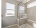Clean bathroom featuring a glass shower with a built in bench and tiled walls at 11880 Whisper Ridge Dr, Noblesville, IN 46060