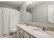 Bathroom featuring double sinks, vanity, and tub with shower at 11880 Whisper Ridge Dr, Noblesville, IN 46060