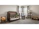 Cozy Bedroom with crib, glider chair, and lots of natural light at 11880 Whisper Ridge Dr, Noblesville, IN 46060