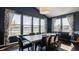 Bright dining room boasts large windows, a modern chandelier, and offers ample natural light with views of backyard at 11880 Whisper Ridge Dr, Noblesville, IN 46060