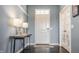 Bright entryway featuring modern lighting, sleek console table, and a welcoming ambiance at 11880 Whisper Ridge Dr, Noblesville, IN 46060