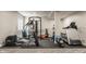 Home gym with modern equipment, including an elliptical and treadmill at 11880 Whisper Ridge Dr, Noblesville, IN 46060