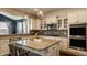 Modern kitchen featuring stainless steel appliances, ample cabinet space, and a center island with bar stool seating at 11880 Whisper Ridge Dr, Noblesville, IN 46060