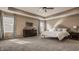 Spacious main bedroom features a tray ceiling, a large bed, and and nightstands at 11880 Whisper Ridge Dr, Noblesville, IN 46060