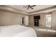 Spacious main bedroom showcasing a ceiling fan, a mirror, and a TV at 11880 Whisper Ridge Dr, Noblesville, IN 46060