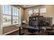 Stylish home office with large windows, providing ample natural light and views of the outdoors at 11880 Whisper Ridge Dr, Noblesville, IN 46060