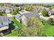 Overhead view showcasing the backyard, surrounding neighborhood, and manicured lawn of a suburban home at 12088 Everwood Cir, Noblesville, IN 46060