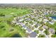 Aerial view showcases a neighborhood's manicured lawns, mature trees, and community ponds, creating a desirable living environment at 12088 Everwood Cir, Noblesville, IN 46060