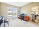 Inviting living room with natural light, a piano, and views of the backyard at 12088 Everwood Cir, Noblesville, IN 46060