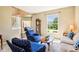 Inviting living room with comfortable seating, a grandfather clock, and ample natural light at 12088 Everwood Cir, Noblesville, IN 46060