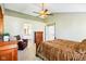 View of a main bedroom suite featuring a ceiling fan and private bathroom at 12088 Everwood Cir, Noblesville, IN 46060