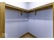 Walk-in closet featuring wooden shelving and trim, providing organized storage at 12249 E Harvest Glen Dr, Cumberland, IN 46229
