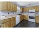 Functional kitchen space featuring white appliances and plenty of cabinet storage at 12249 E Harvest Glen Dr, Cumberland, IN 46229
