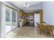 Bright kitchen with light wood cabinetry, stainless steel appliances, and a sliding door to the outside at 12249 E Harvest Glen Dr, Cumberland, IN 46229