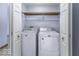 Closet laundry room featuring a side-by-side washer and dryer at 12249 E Harvest Glen Dr, Cumberland, IN 46229