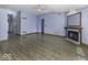 Open-concept living area with fireplace, seamlessly flowing design, and lots of natural light at 12249 E Harvest Glen Dr, Cumberland, IN 46229