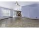 Spacious living area with hardwood floors that flows into the kitchen at 12249 E Harvest Glen Dr, Cumberland, IN 46229
