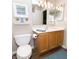 Well-maintained bathroom featuring a white vanity, warm-toned wood cabinets, and neutral wall color at 12678 Brewton St, Fishers, IN 46038