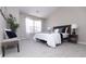 Inviting bedroom featuring a comfortable bed, soft carpeting, and a large window providing natural light, creating a cozy retreat at 12678 Brewton St, Fishers, IN 46038